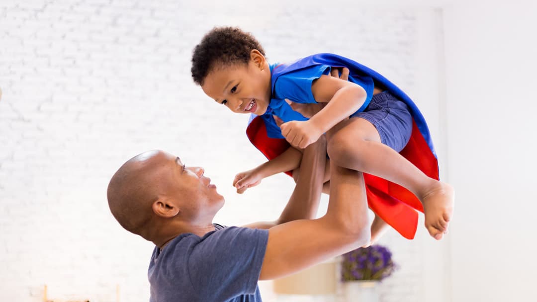 Dad playing with son
