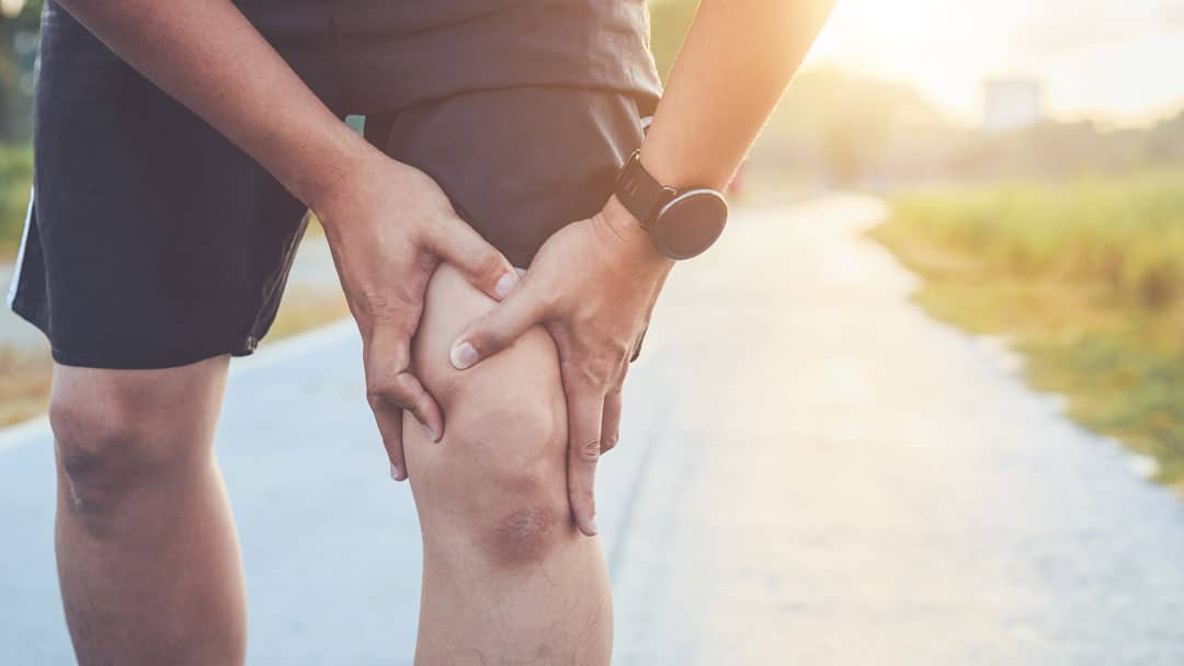 Man exercising with knee pain