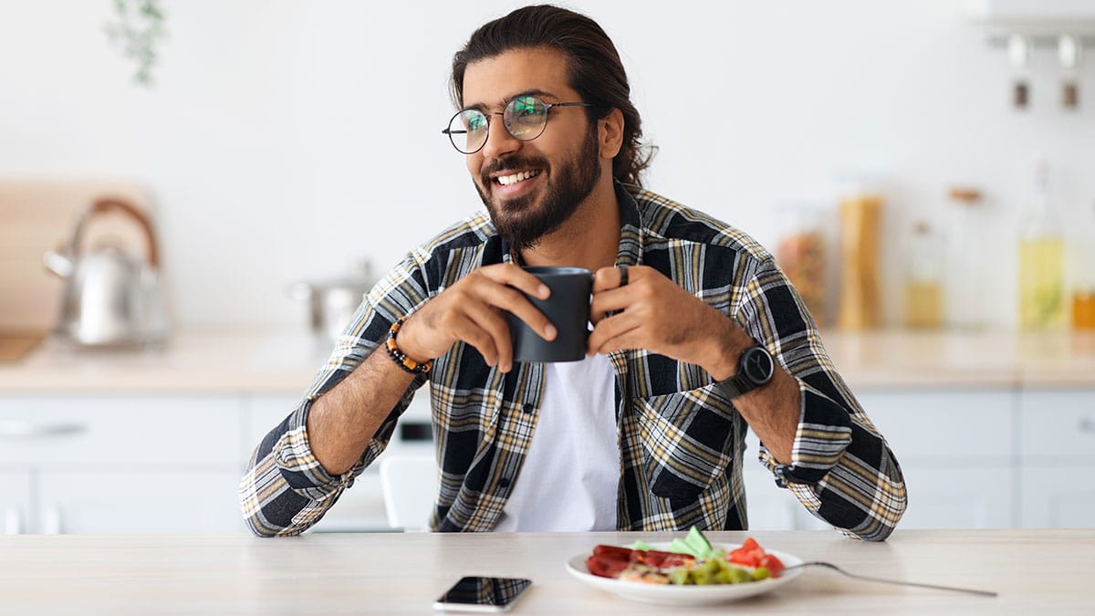 Happy man drinking coffee