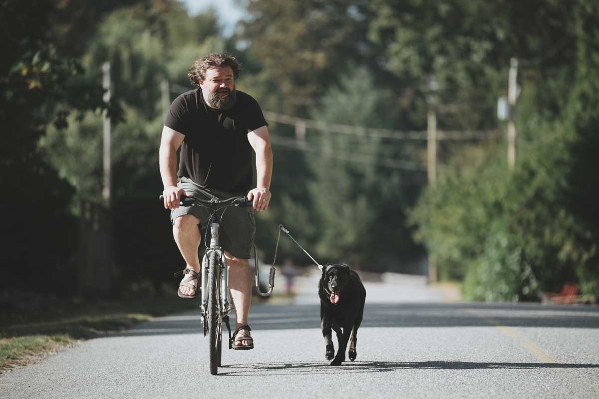 Toby Hargrave biking with dog